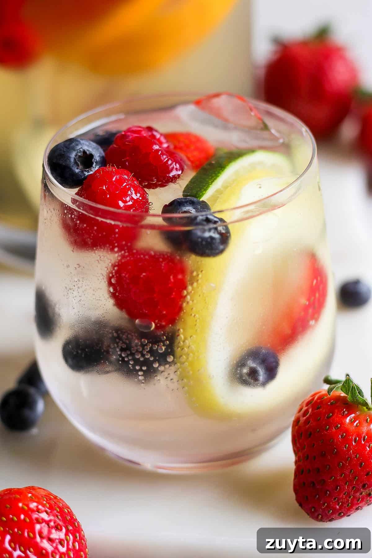 White Sangria Recipe with Citrus and Fresh Berries 7 A glass of white wine sangria.