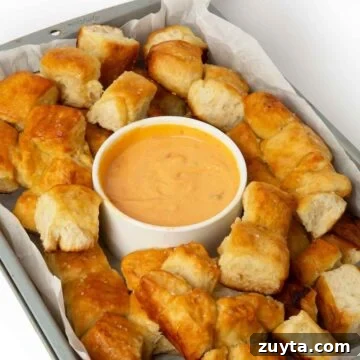 Air Fryer Oreos Recipe: Crispy, Gooey Dessert 15 pretzel bite monkey bread in tray with cheese dipping sauce