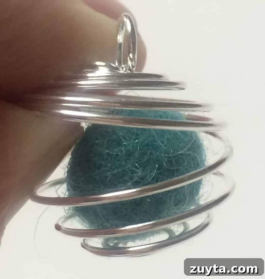 How to Make an Essential Oil Diffuser Necklace 10 wool felt ball inside of wire cage pendant