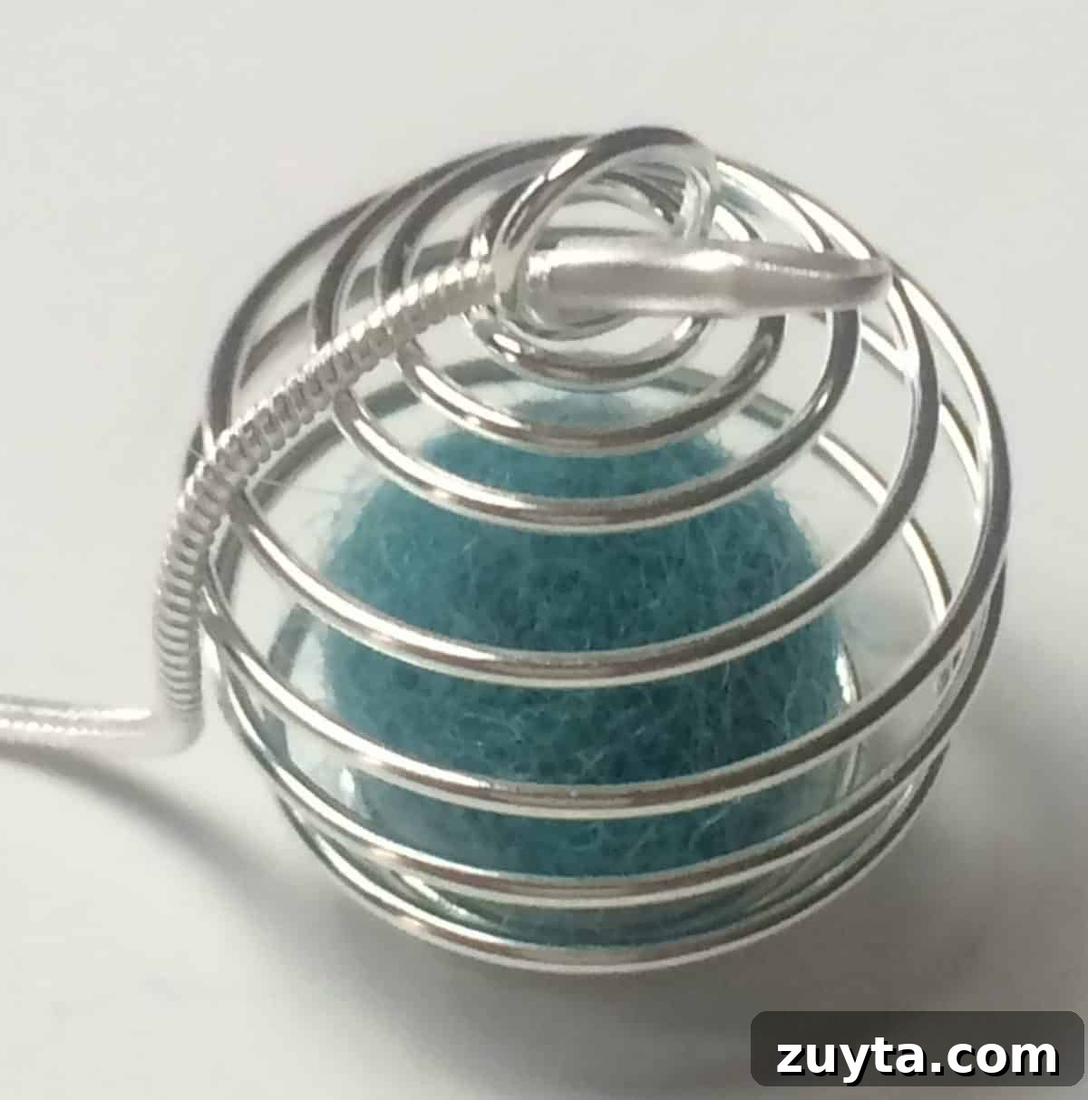 How to Make an Essential Oil Diffuser Necklace 11 end of silve snake chain necklace going through pendant loop