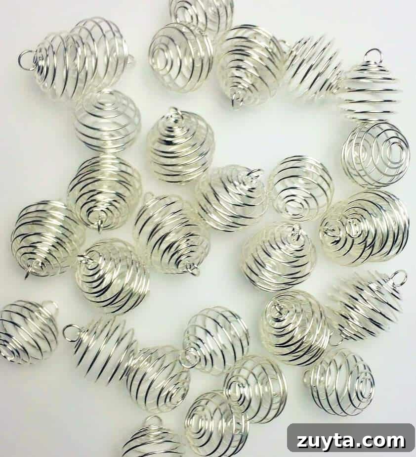 How to Make an Essential Oil Diffuser Necklace 2 a pile of silver wire cage pendants used to make diffuser jewelry