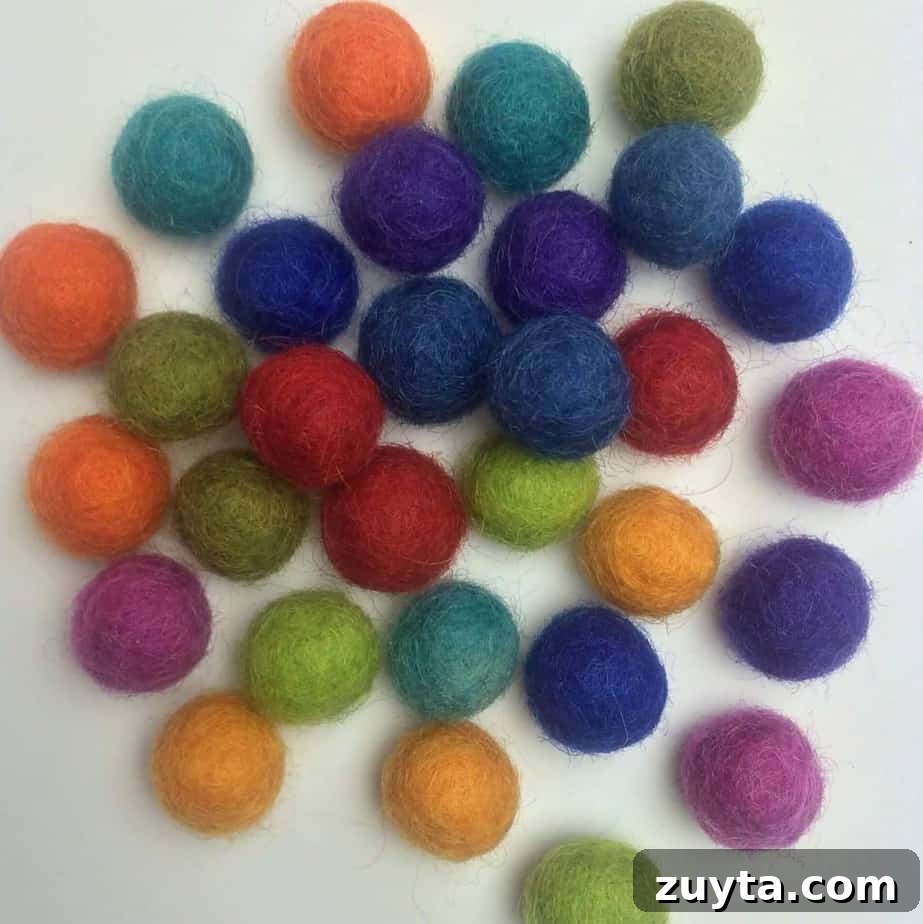 How to Make an Essential Oil Diffuser Necklace 7 a pile of small colorful wool balls that will be used inside of the wire cage necklace pendants