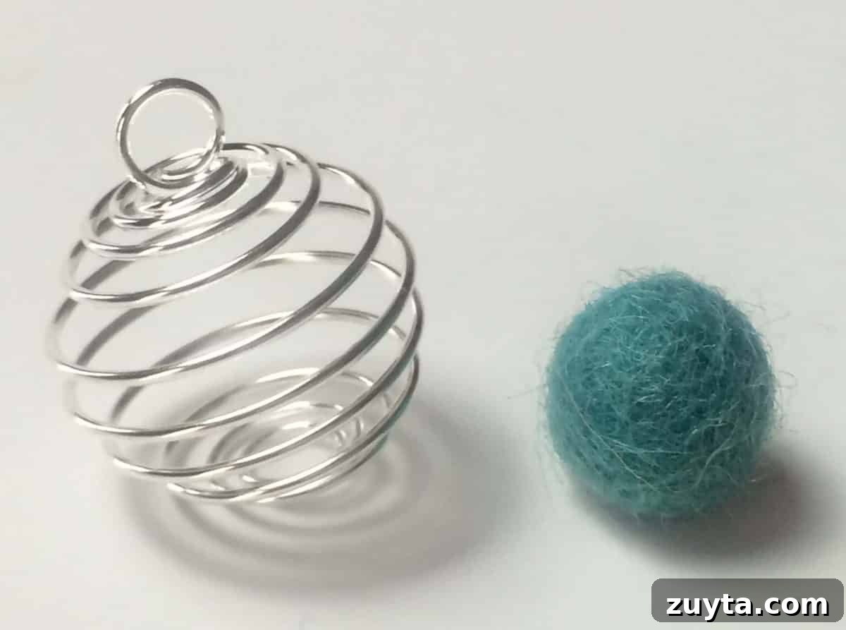 How to Make an Essential Oil Diffuser Necklace 8 wire cage pendant and small cyan wool ball
