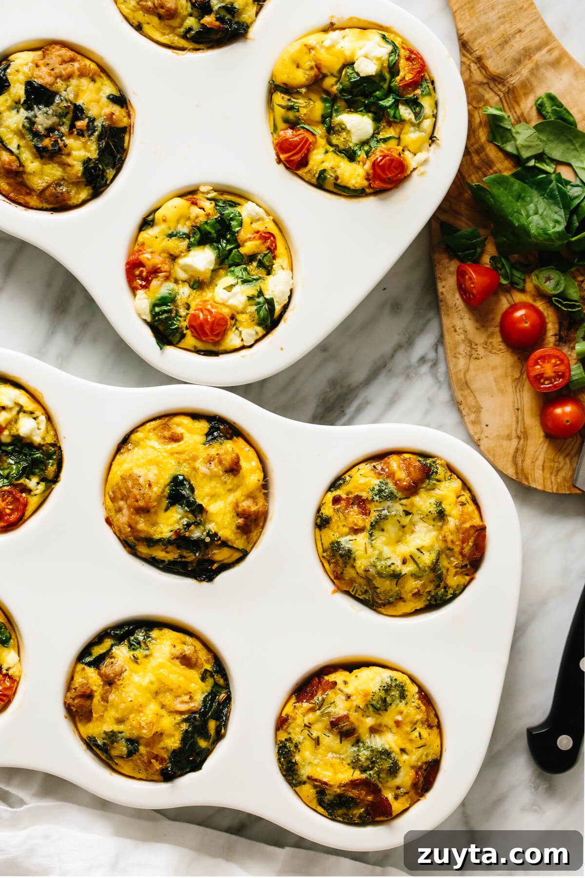 Over 60 Mediterranean Diet Recipes for Every Meal 18 A variety of egg muffins on a table.