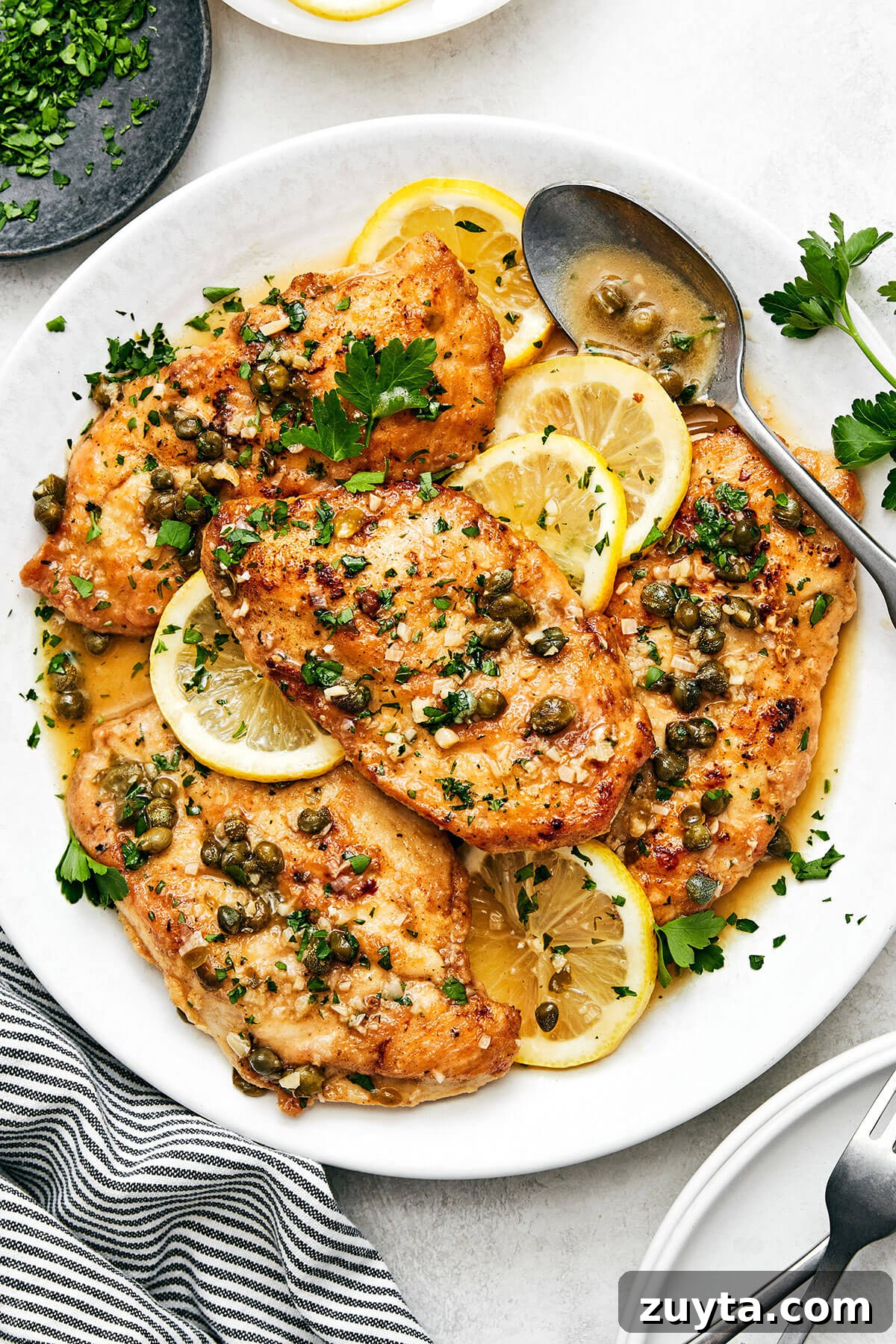 Over 60 Mediterranean Diet Recipes for Every Meal 6 Chicken piccata in a white serving dish