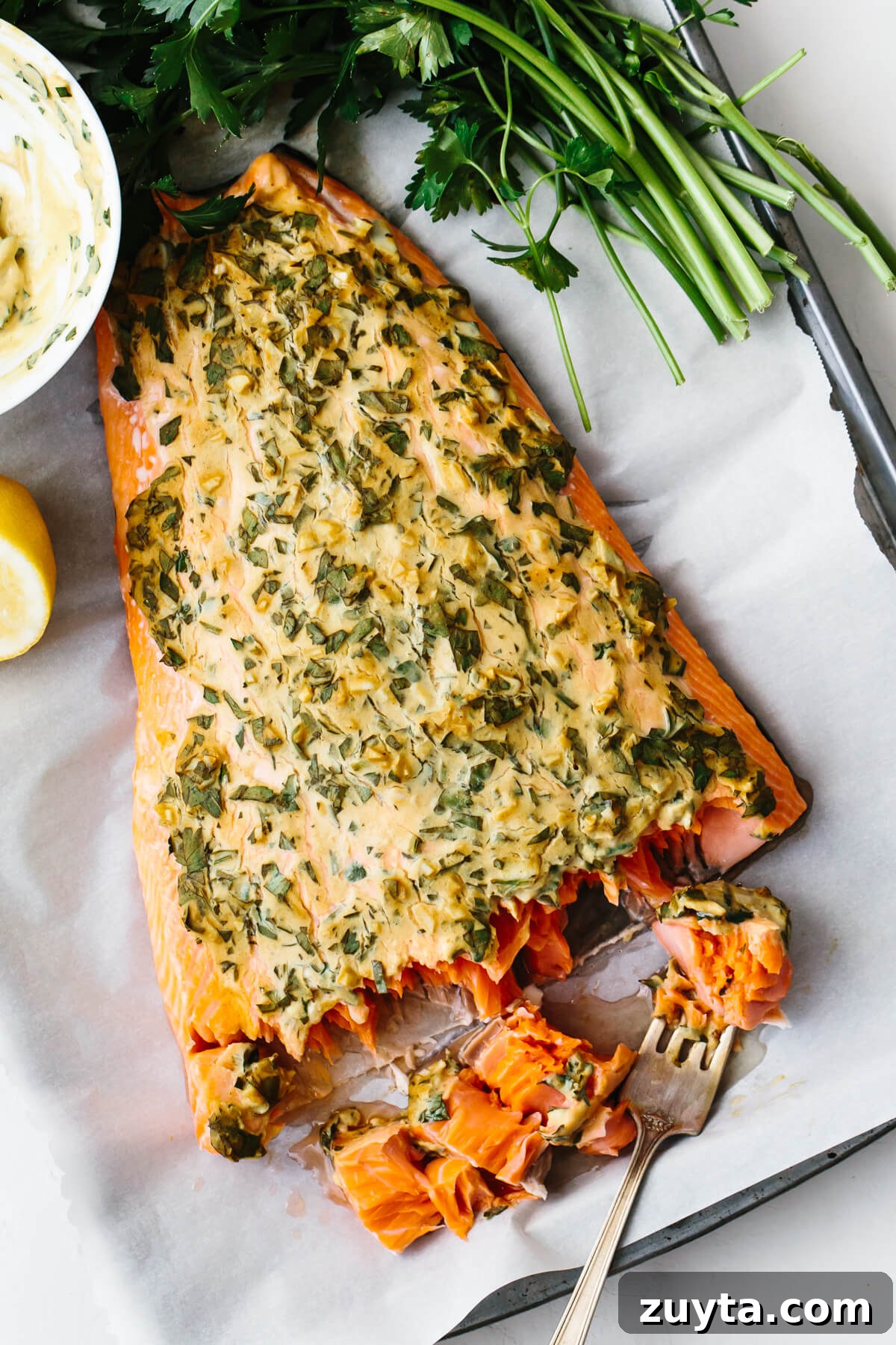 Over 60 Mediterranean Diet Recipes for Every Meal 66 Dijon baked salmon on a tray with a fork.