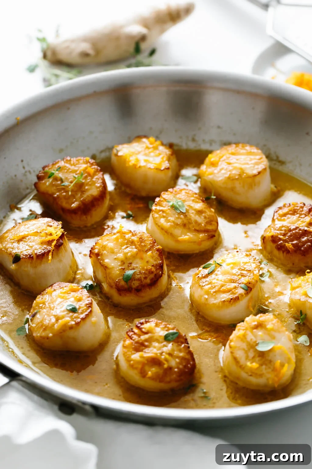 Over 60 Mediterranean Diet Recipes for Every Meal 67 Several scallops in a pan.