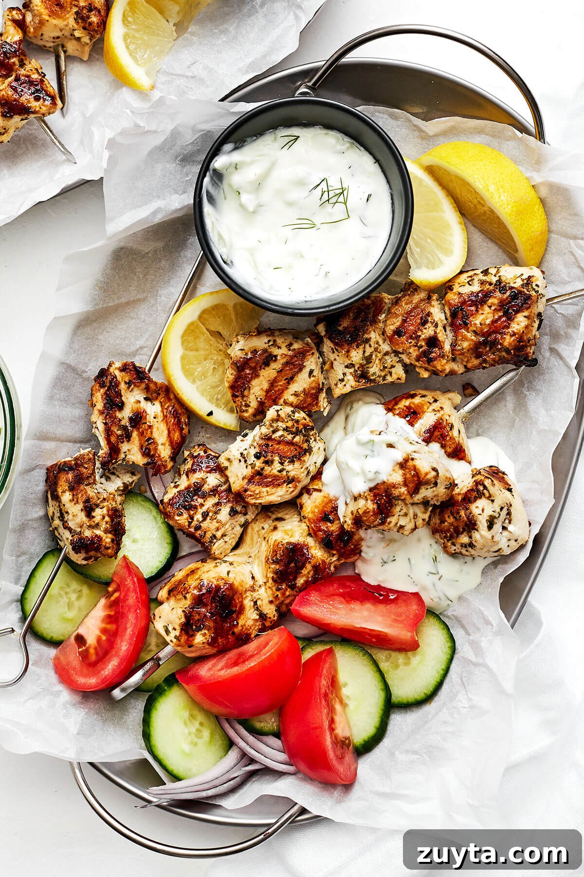 Over 60 Mediterranean Diet Recipes for Every Meal 76 Grilled chicken souvlaki on a plate