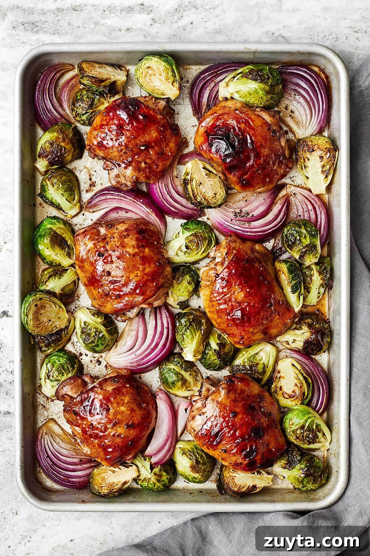 Over 60 Mediterranean Diet Recipes for Every Meal 77 Balsamic chicken and Brussels sprouts on a sheet pan