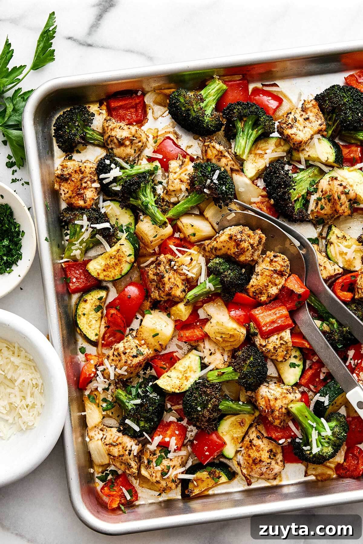 Over 60 Mediterranean Diet Recipes for Every Meal 79 Italian sheet pan dinner with chicken breast and vegetables.