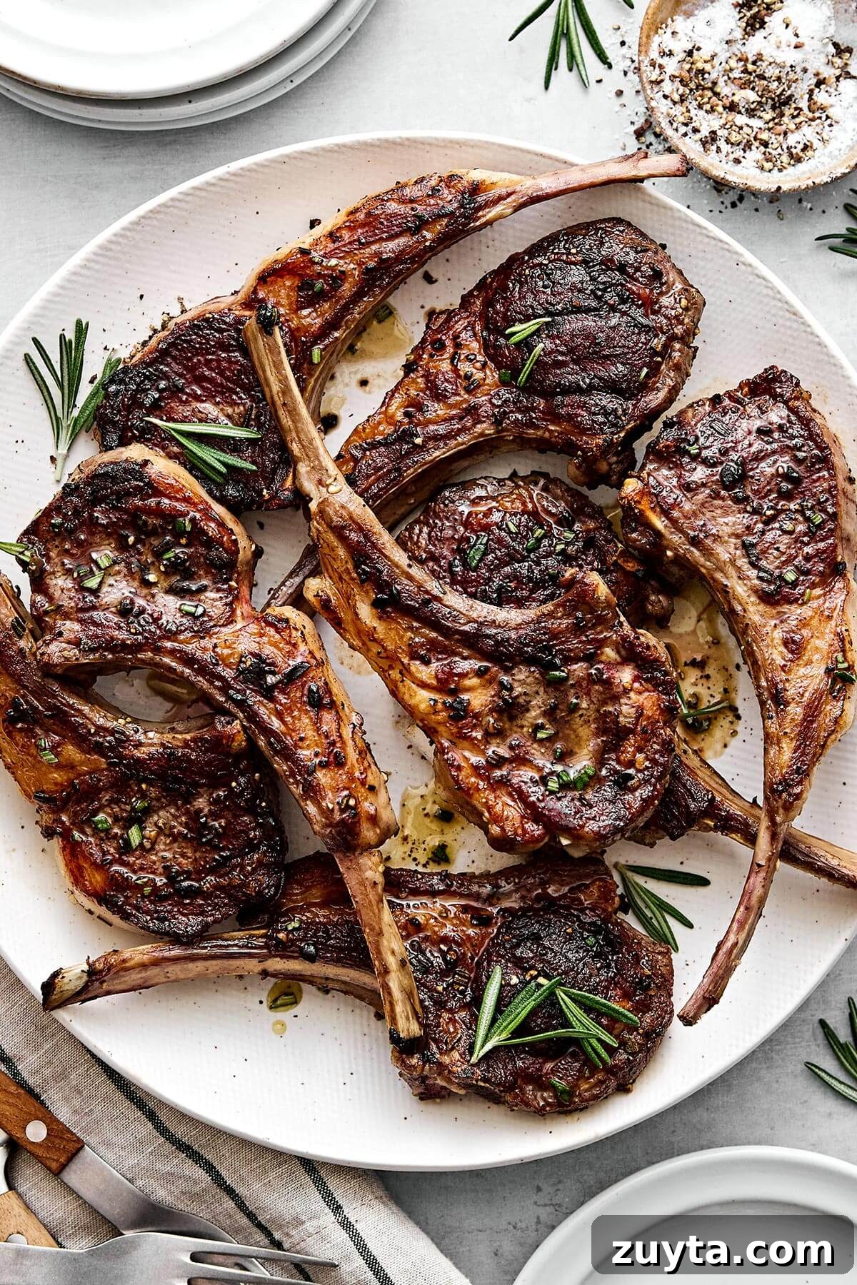 Over 60 Mediterranean Diet Recipes for Every Meal 82 A plate of rosemary grilled lamb chops for holiday dinners like Easter or summer cookouts.