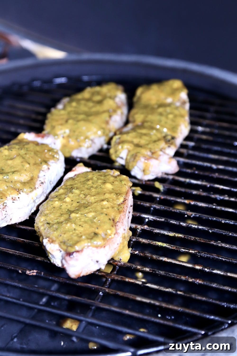 BBQ Pork Chops with Rosemary Mustard Glaze Recipe 2 4 pork chops on a grill with mustard bbq sauce