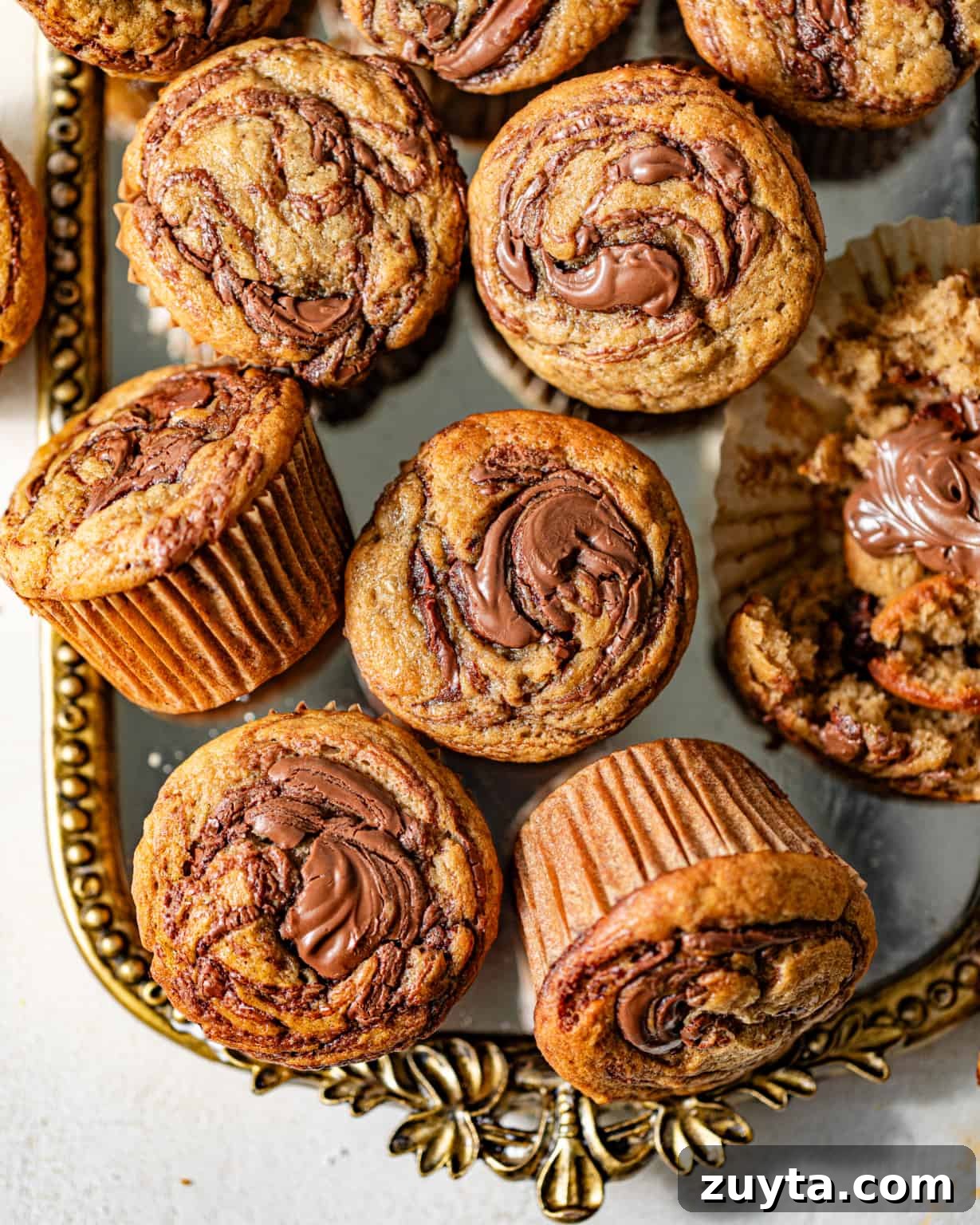 banana nutella muffins on a gold mirror tray