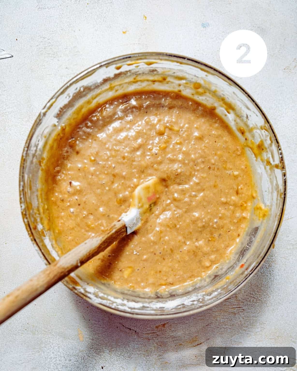 mashed bananas in a large mixing bowl