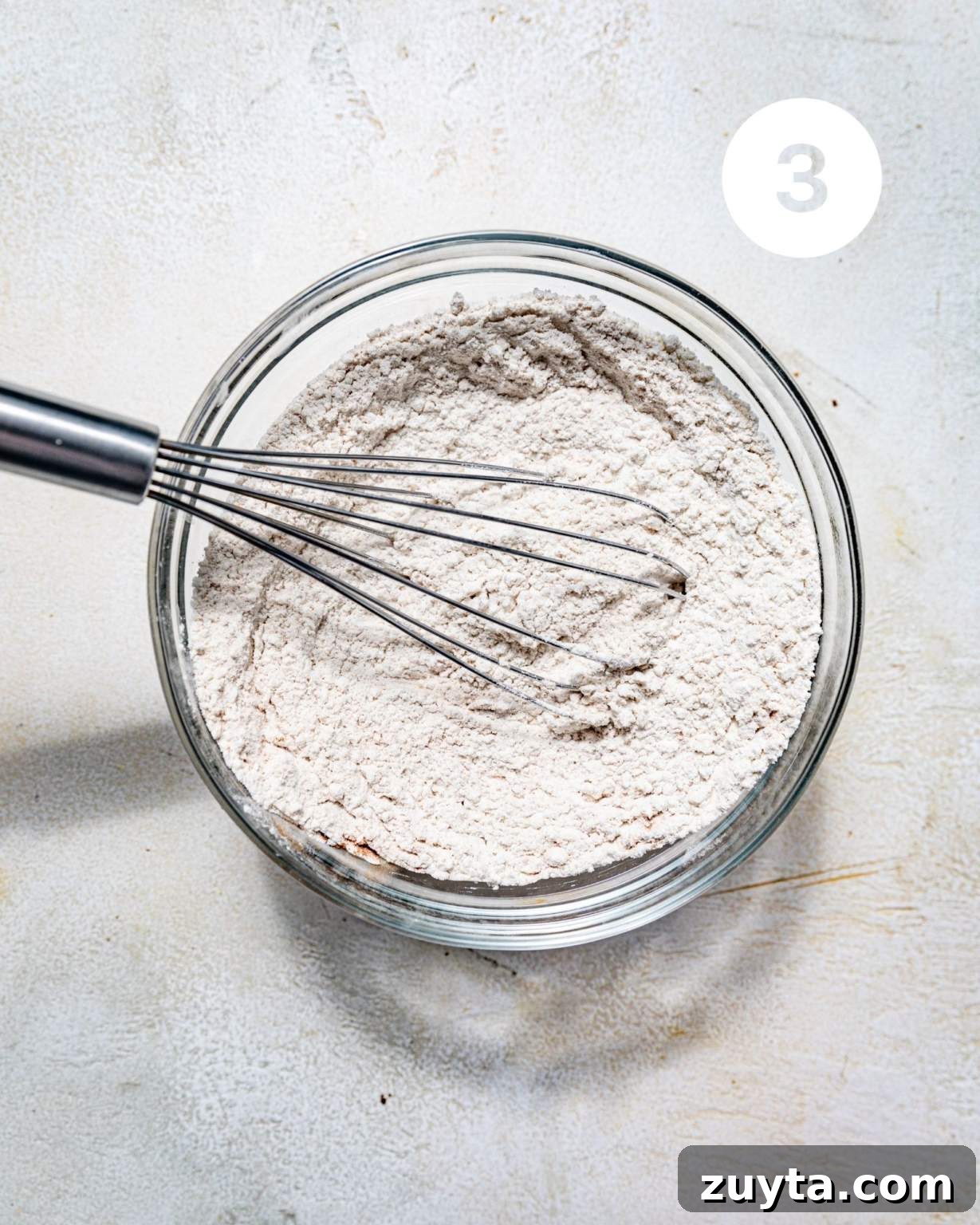 flour, baking soda, kosher salt, cinnamon, and nutmeg whisked together in a glass bowl.