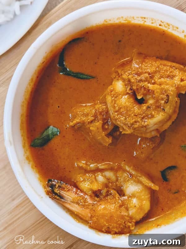 Mangalorean Prawn Gassi: Authentic Coconut Prawn Curry 2 Prawn Gassi served in a white bowl