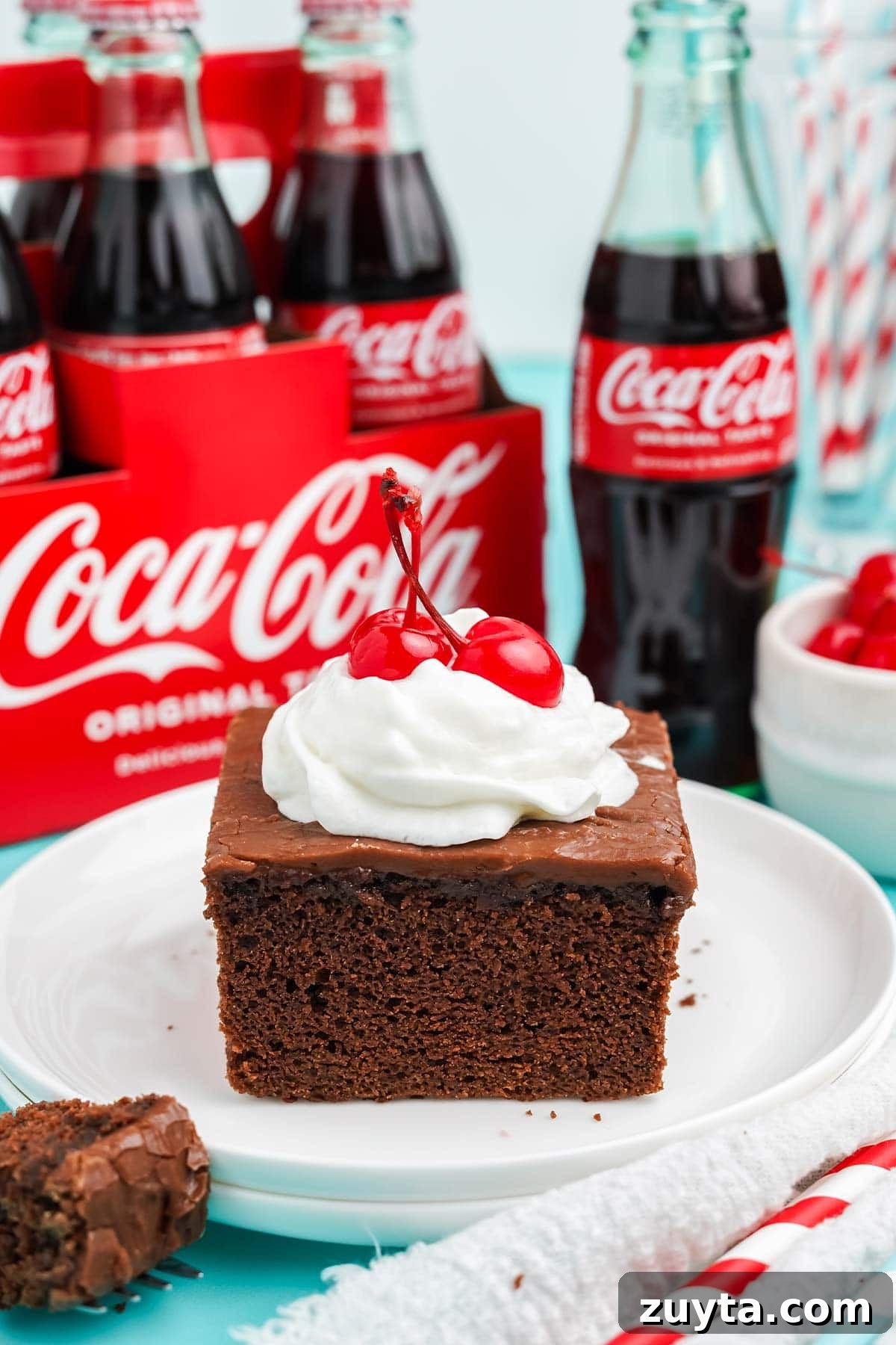 Copycat Cracker Barrel Coca-Cola Cake Recipe 2 Slice of Cracker Barrel coca cola cake recipe on a plate.
