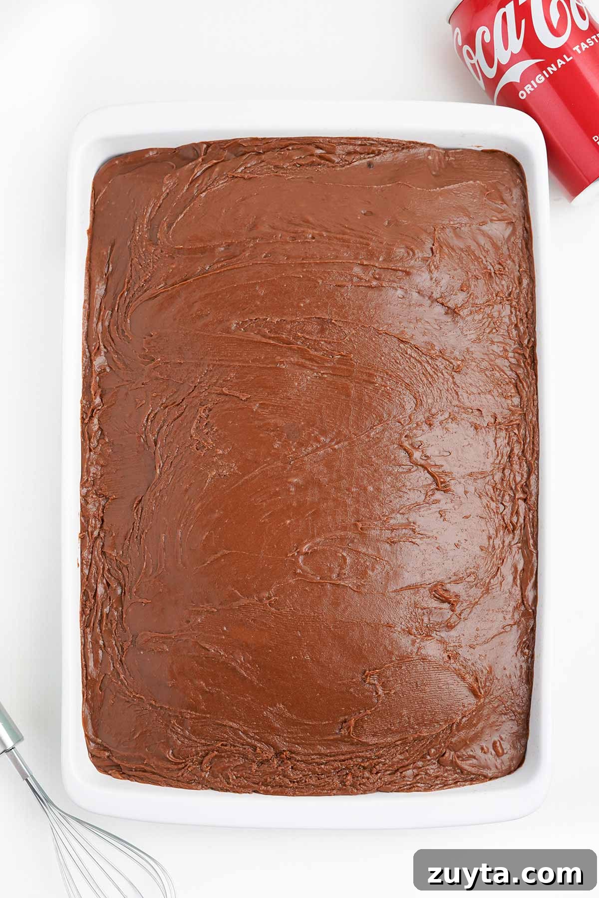 Copycat Cracker Barrel Coca-Cola Cake Recipe 9 Finished coca cola cake in the pan with icing on top.