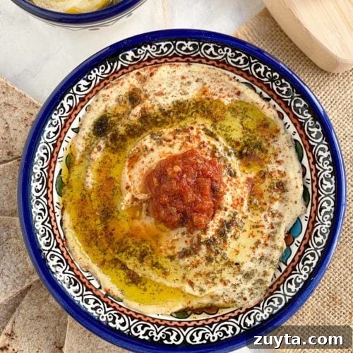 Preserved lemon hummus in blue bowl