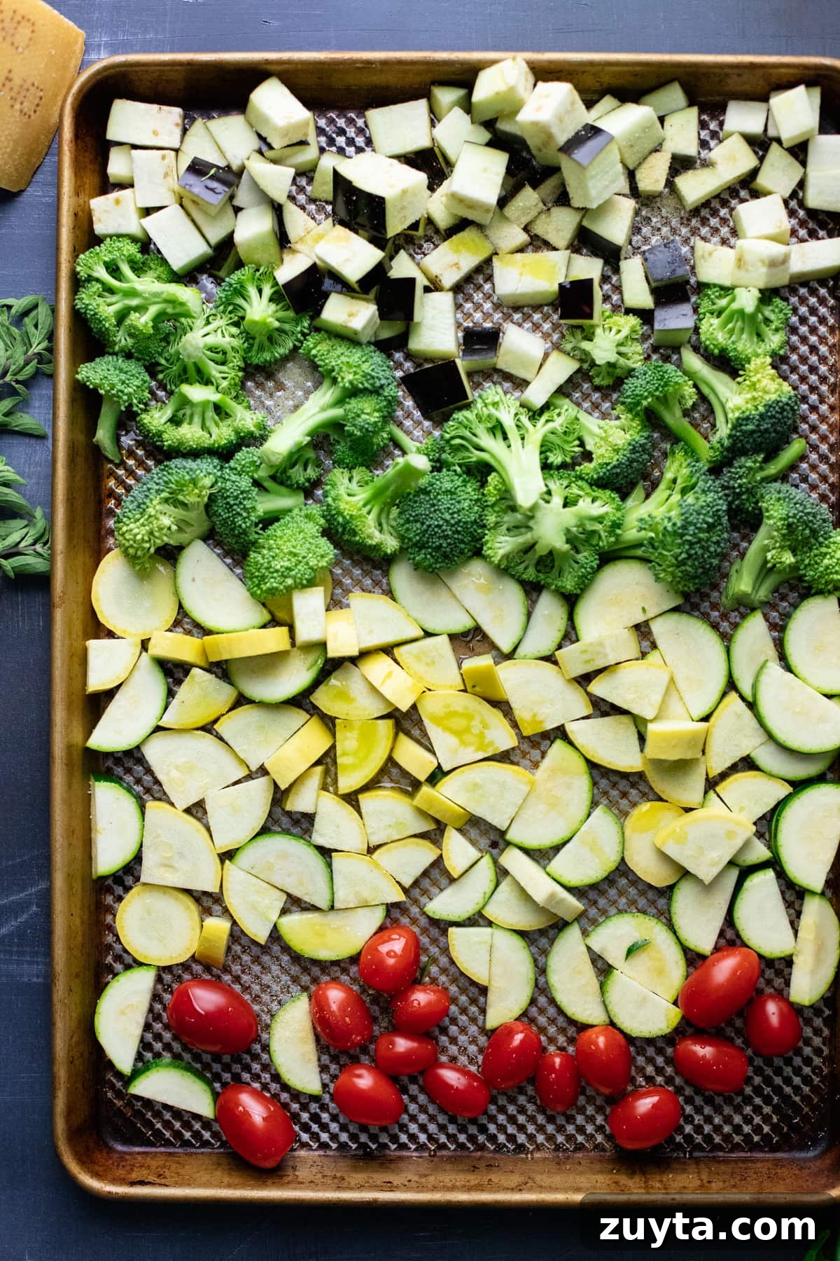 chopped vegetables arranged on a sheet pan.