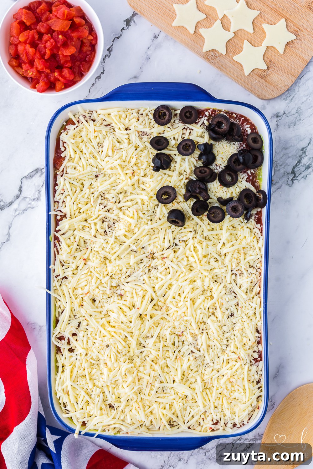 Patriotic American Flag 7 Layer Dip for Fourth of July 11 Olives and white chips