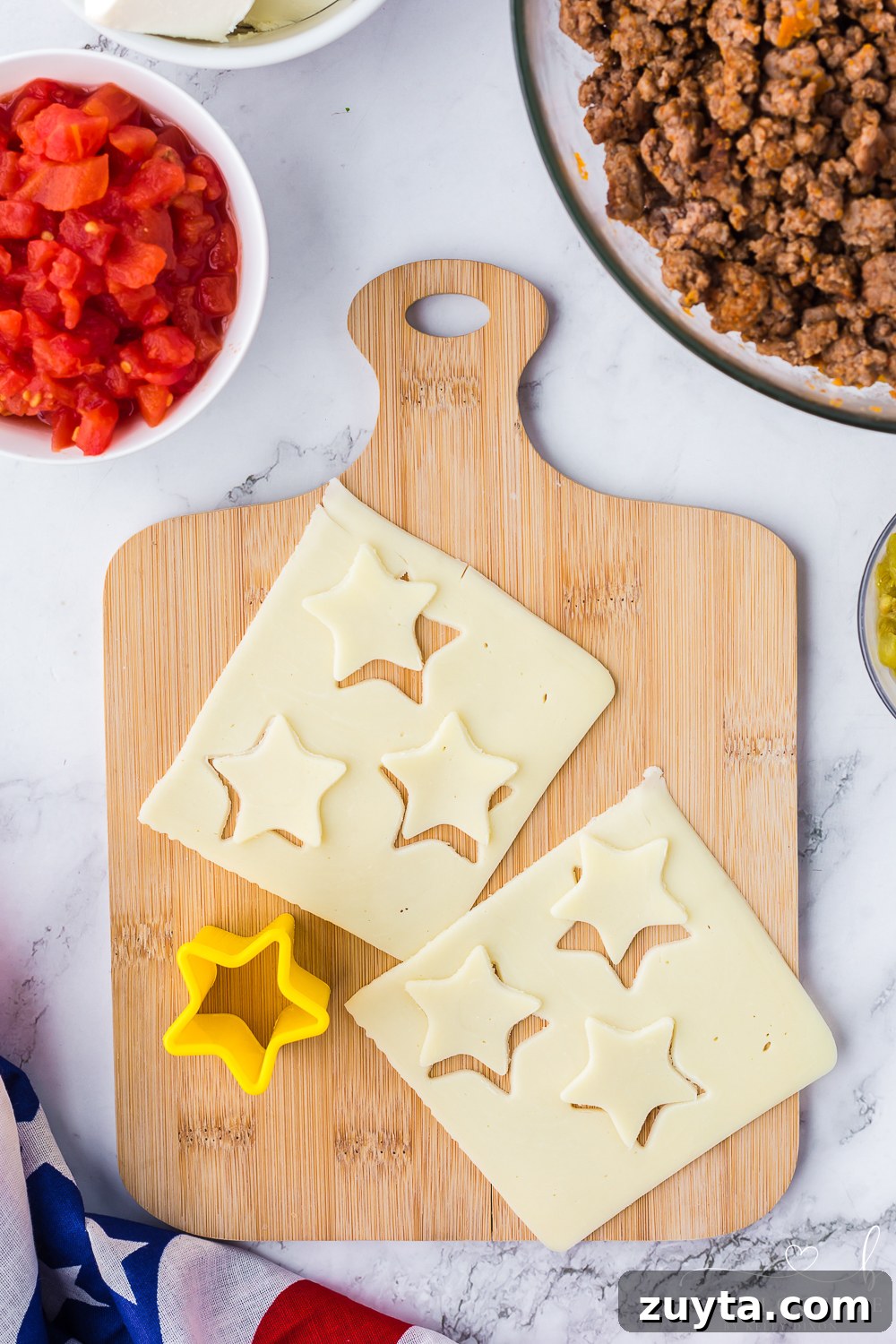 Patriotic American Flag 7 Layer Dip for Fourth of July 5 Cheese stars with cookie cutter