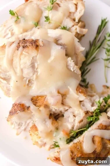 turkey gravy on turkey served on a plate