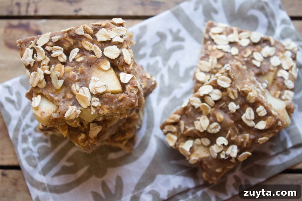 Apple Cinnamon Oatmeal Bars with Walnuts: Ready in 10 Minutes 3 cinnamon apple oatmeal bars on a patterned napkin