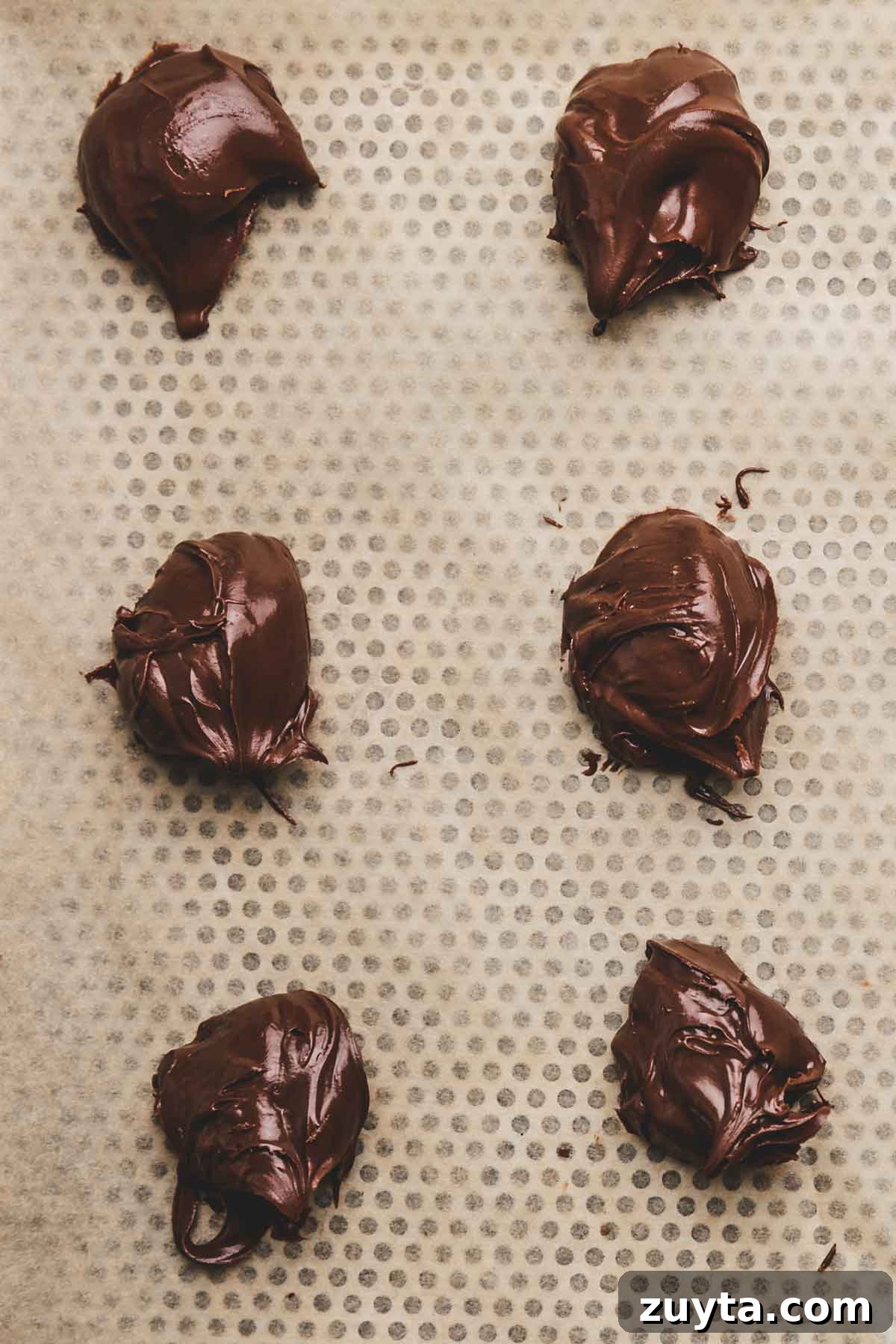 Spoon of frozen Nutella for stuffed cookies