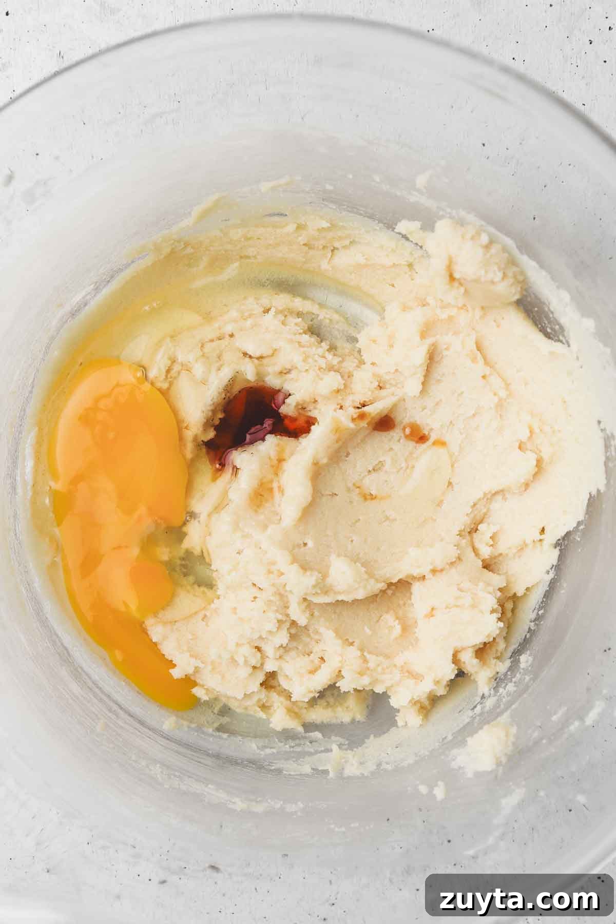 Mixing bowl with butter, egg, and vanilla extract