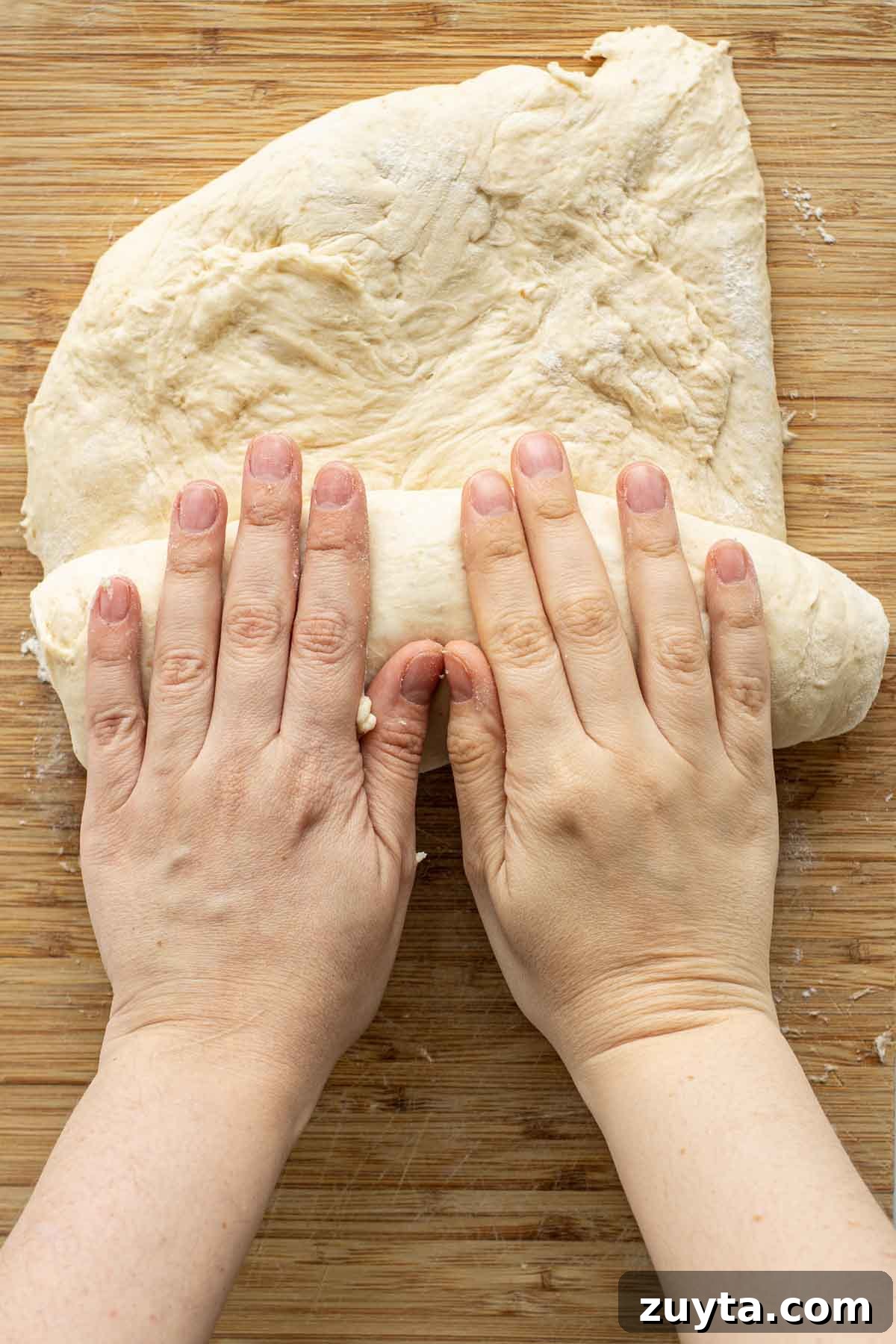 Make Sourdough Sandwich Bread in One Day 11 Rolling opened dough over itself.