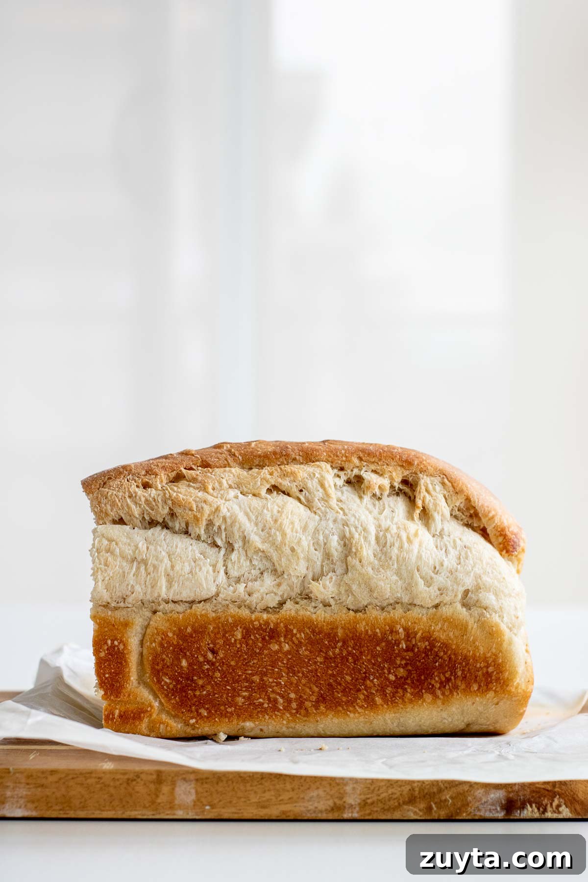 Make Sourdough Sandwich Bread in One Day 17 A sandwich bread that has burst during baking.