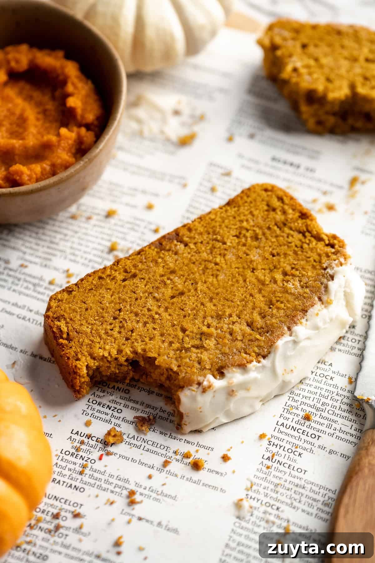 Slice of pumpkin bread with bite taken out of corner Slice of pumpkin bread with bite taken out of corner