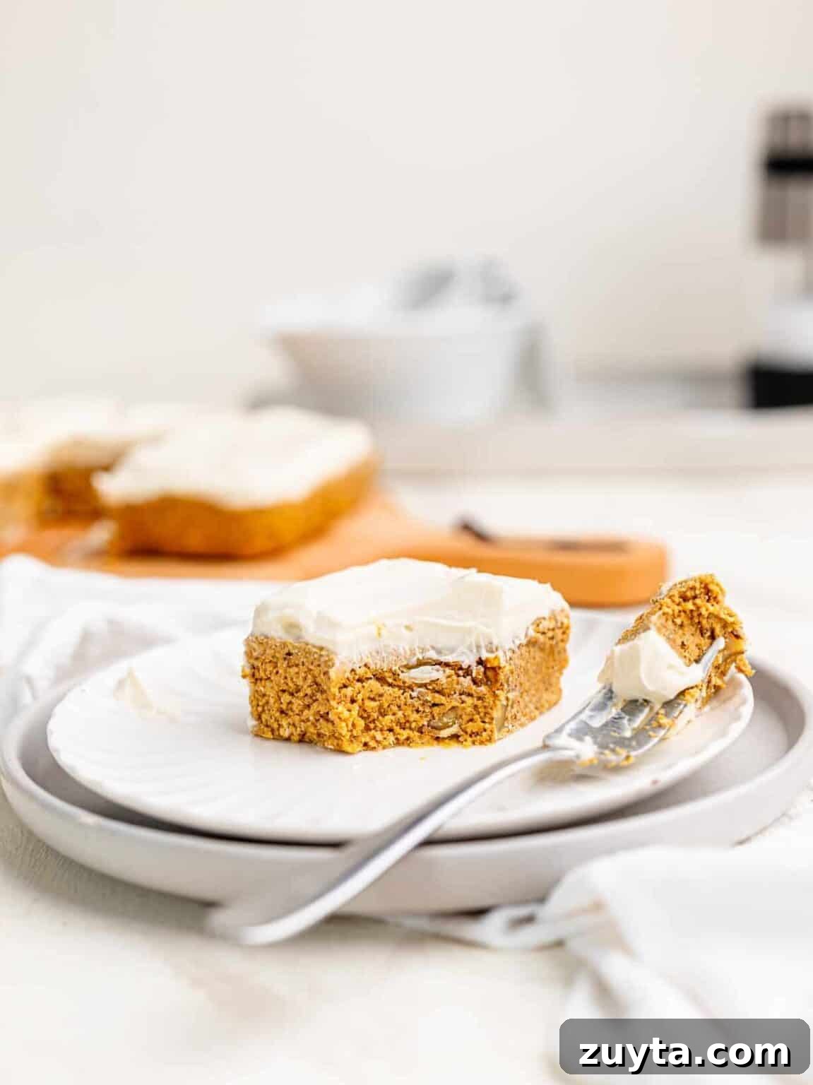 12 No-Bake Dessert Recipes for Parties and Weeknights 9 A slice of no bake carrot cake on a white plate.