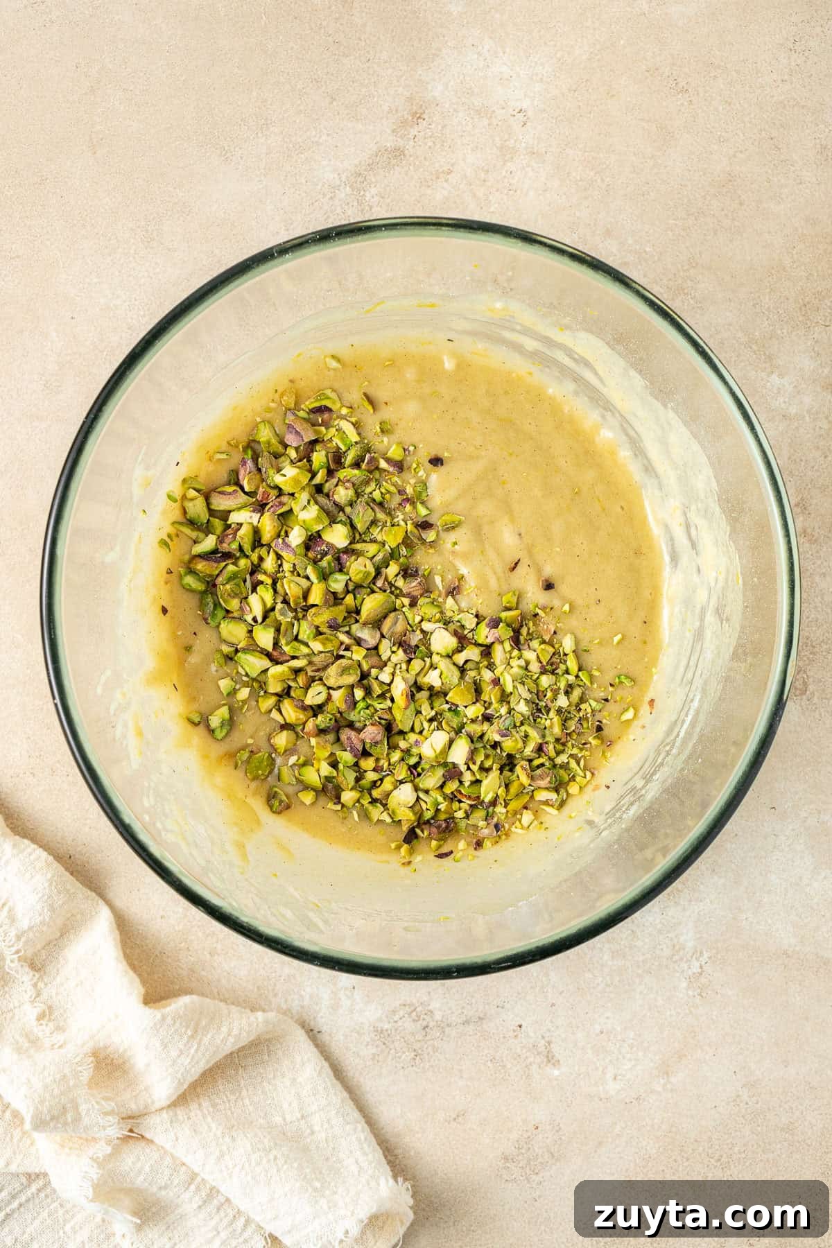 Lemon Pistachio Loaf Cake with Cardamom 7 Adding the chopped pistachios to the batter.