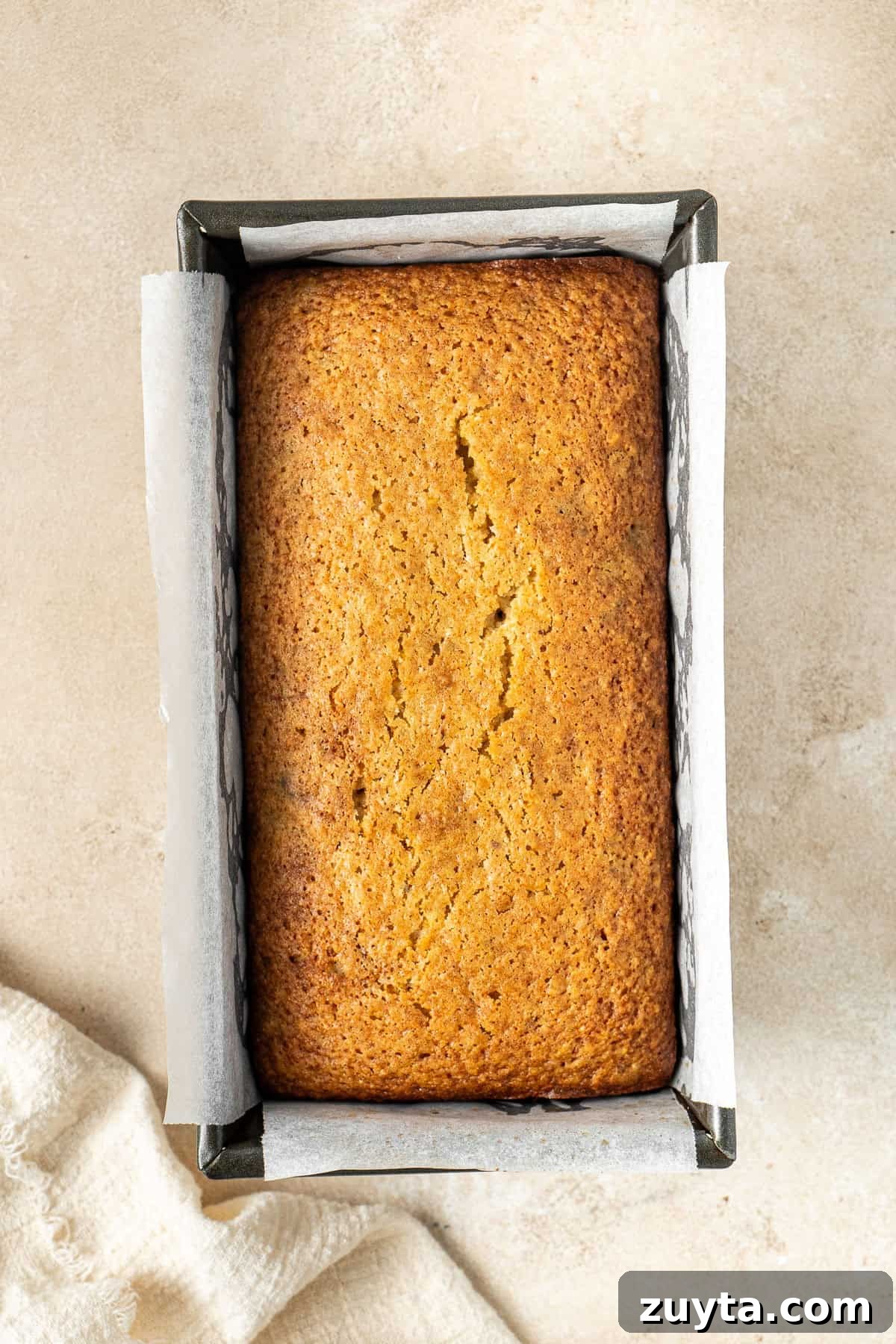Lemon Pistachio Loaf Cake with Cardamom 8 The cooked cake in a loaf pan.