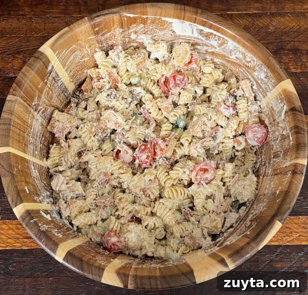 Tossing the pasta salad
