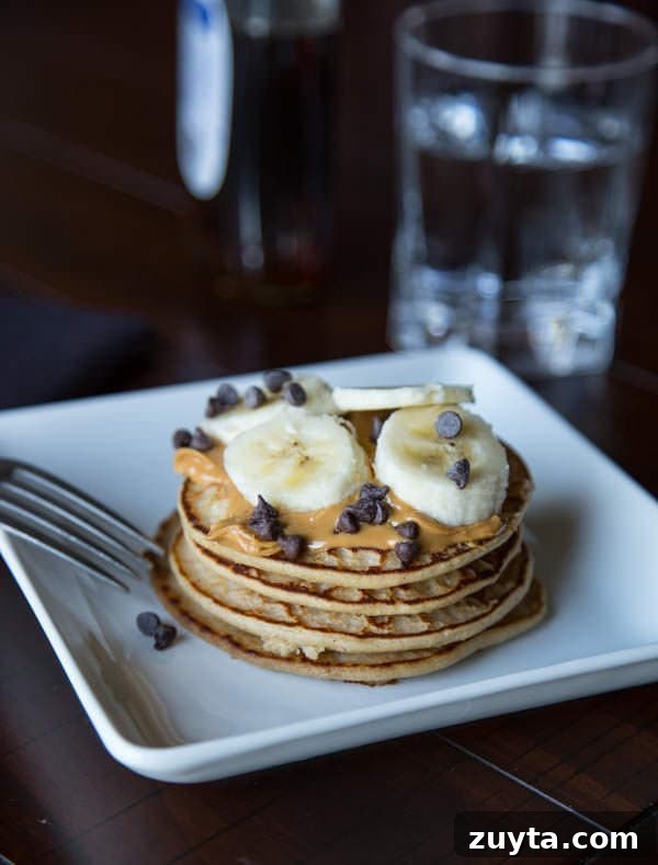 Fluffy Protein Pancakes: High-Protein Breakfast Recipe 2 protein pancakes on a plate