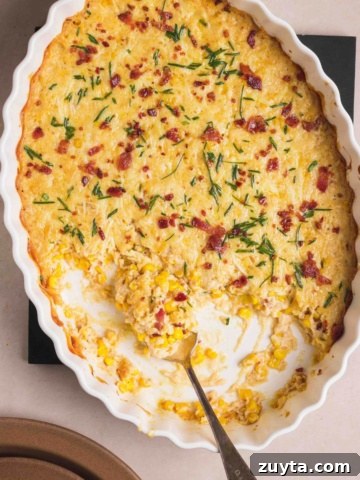 Cheesy Corn Casserole served in a casserole dish.