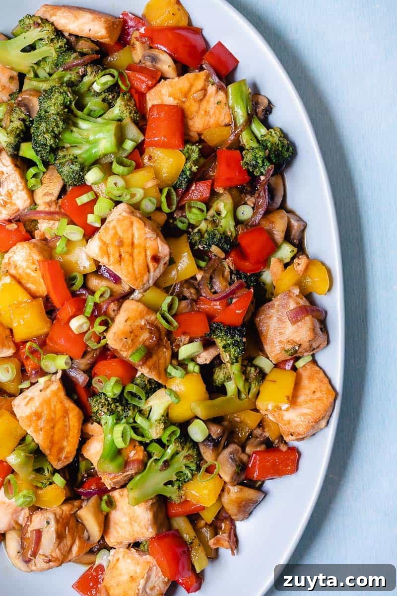 Soy-Ginger Salmon Stir-Fry with Vegetables 2 salmon vegetable stir fry on platter.