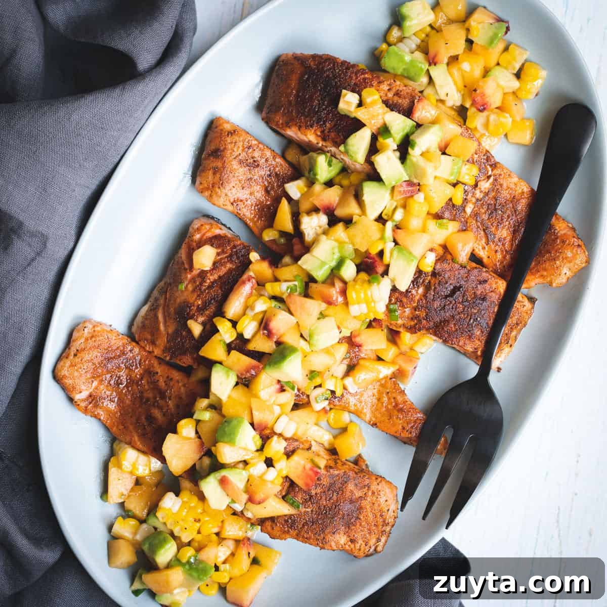 Soy-Ginger Salmon Stir-Fry with Vegetables 15 old bay salmon on platter with peach-avocado salsa on top with serving fork