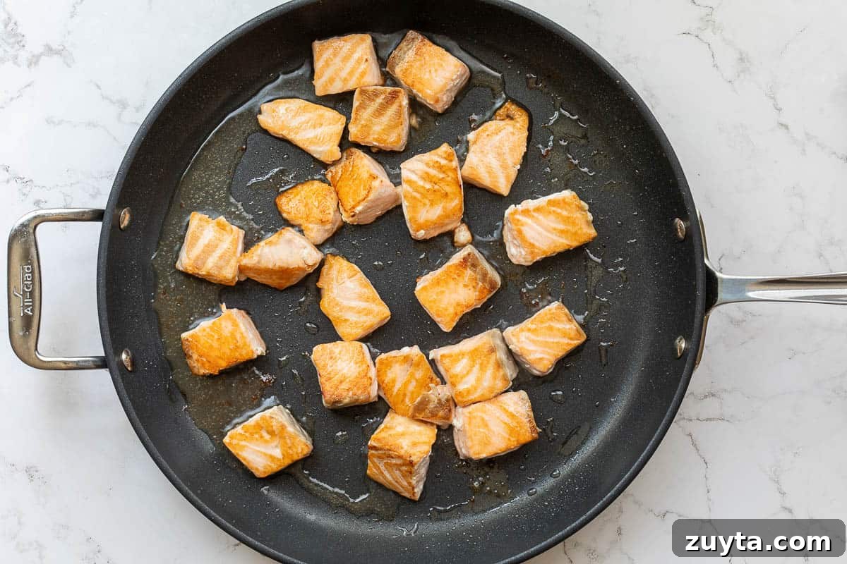 Soy-Ginger Salmon Stir-Fry with Vegetables 7 sautéing salmon cubes in large skillet.