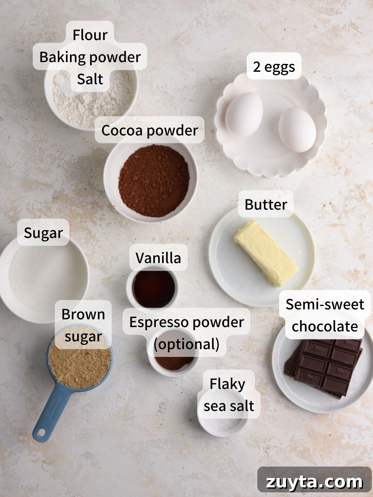 Fudgy Brownie Crinkle Cookies Recipe 2 Labeled ingredients needed to make brownie crinkle cookies laid out on a table.