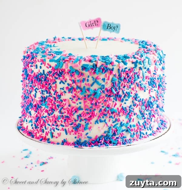 Tall 6-layer white cake covered with sweet and tangy cream cheese frosting and filled with colorful candies and sprinkles inside. Deliciously fun way to reveal the gender of a new bundle of joy!
