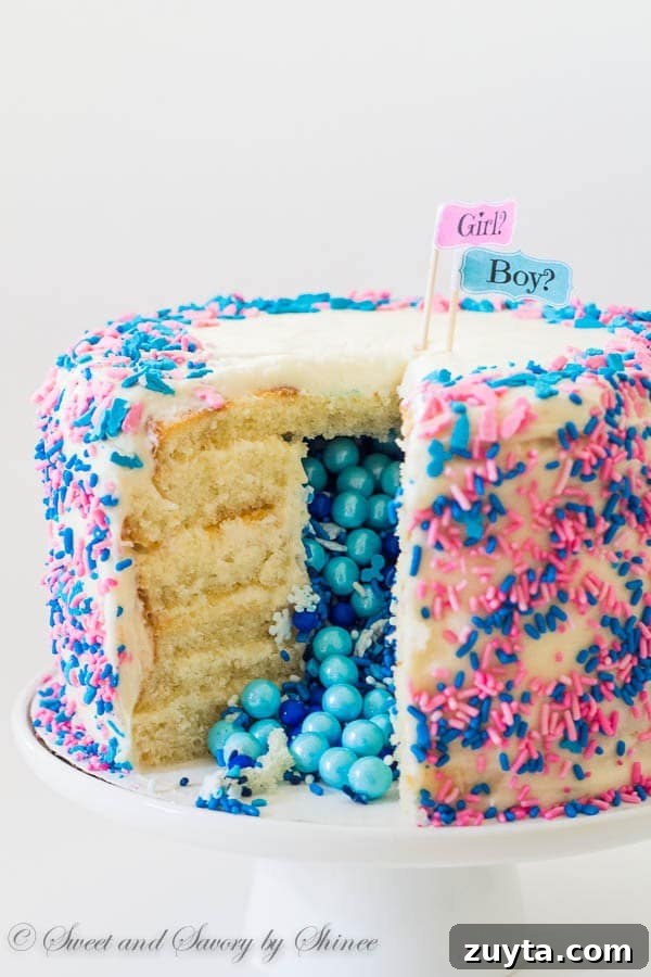 Tall 6-layer white cake covered with sweet and tangy cream cheese frosting and filled with colorful candies and sprinkles inside. Deliciously fun way to reveal the gender of a new bundle of joy!
