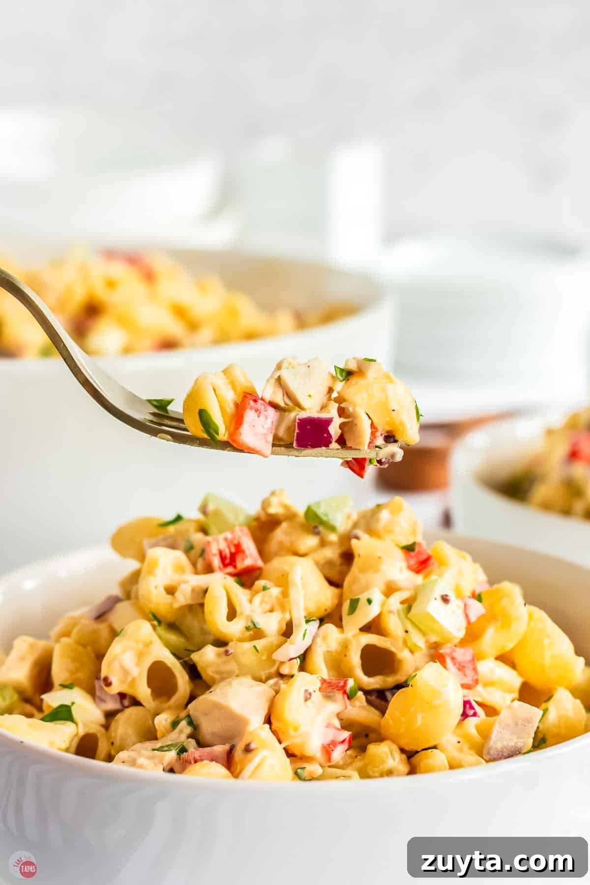 Creamy Chicken Macaroni Salad Recipe 11 fork with bite of macaroni salad