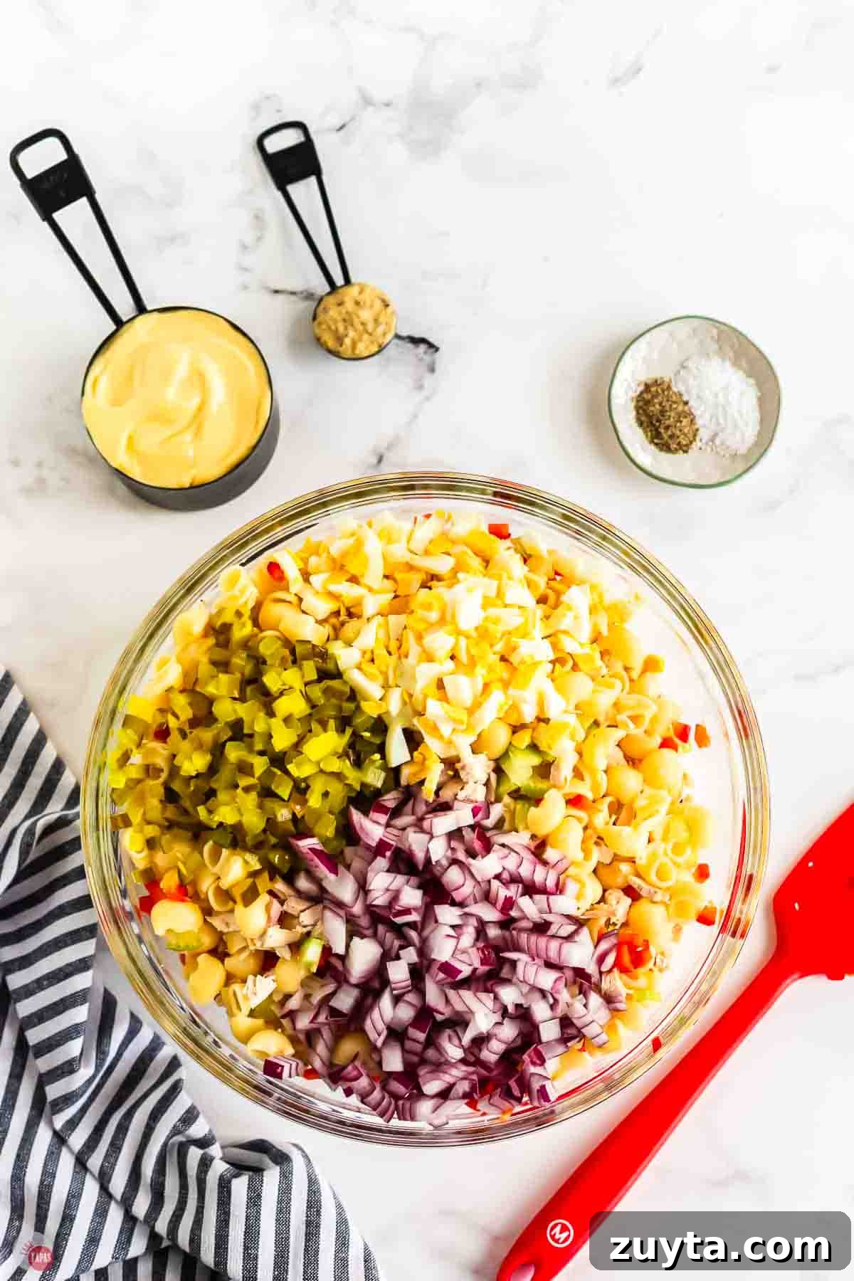 Creamy Chicken Macaroni Salad Recipe 5 salad with diced red onion, eggs, and pickle relish