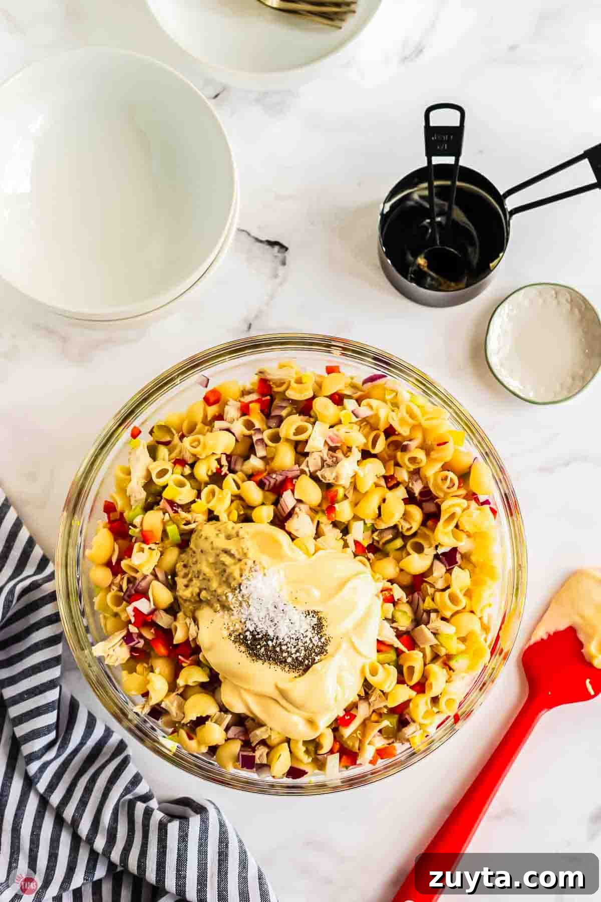 Creamy Chicken Macaroni Salad Recipe 6 undressed pasta salad in a clear mixing bowl