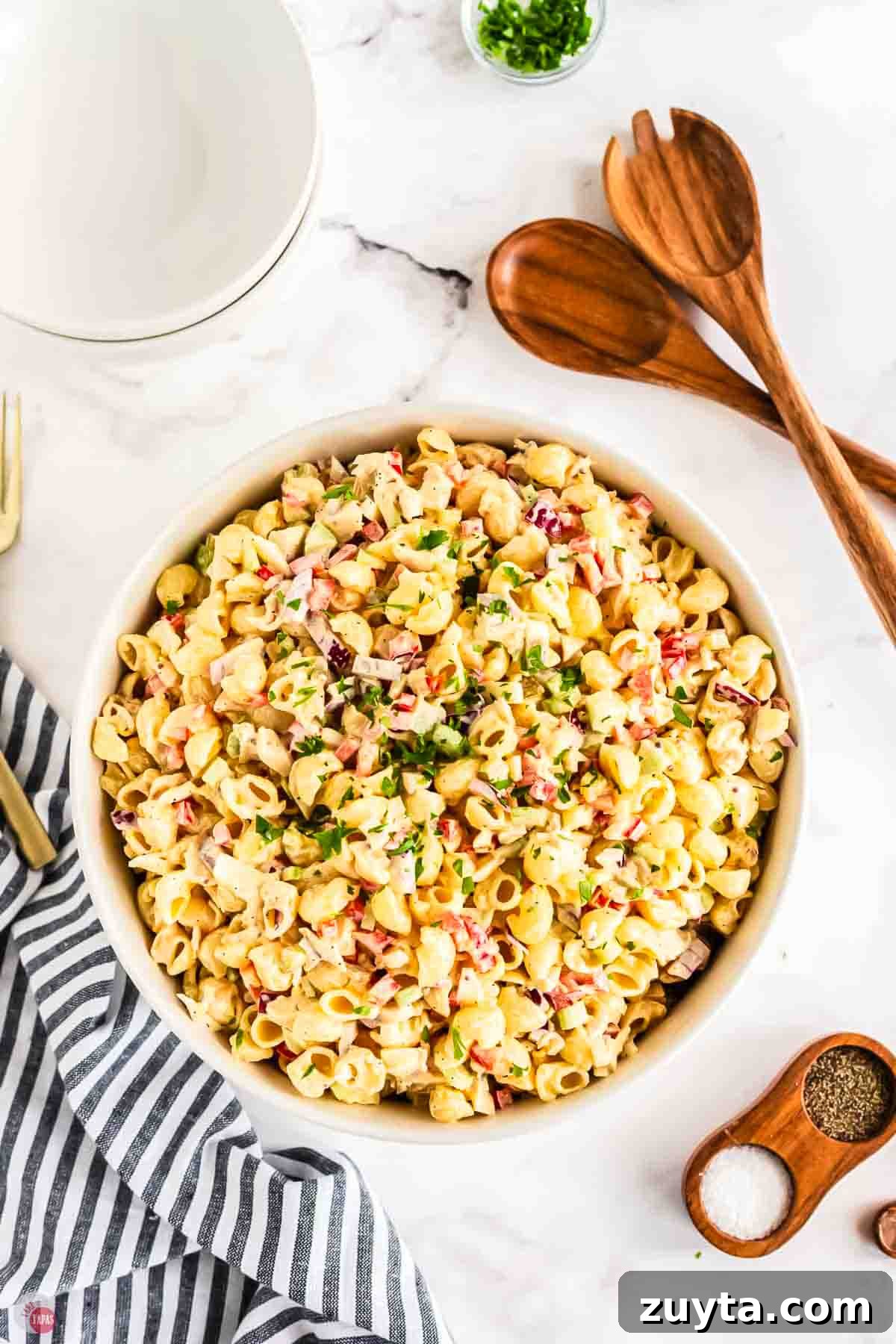 Creamy Chicken Macaroni Salad Recipe 8 bowl of pasta salad with two wood spoons