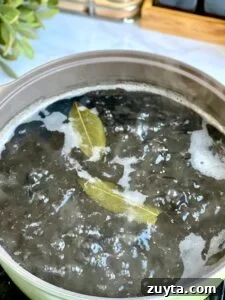 Boiling beans with bay leaves